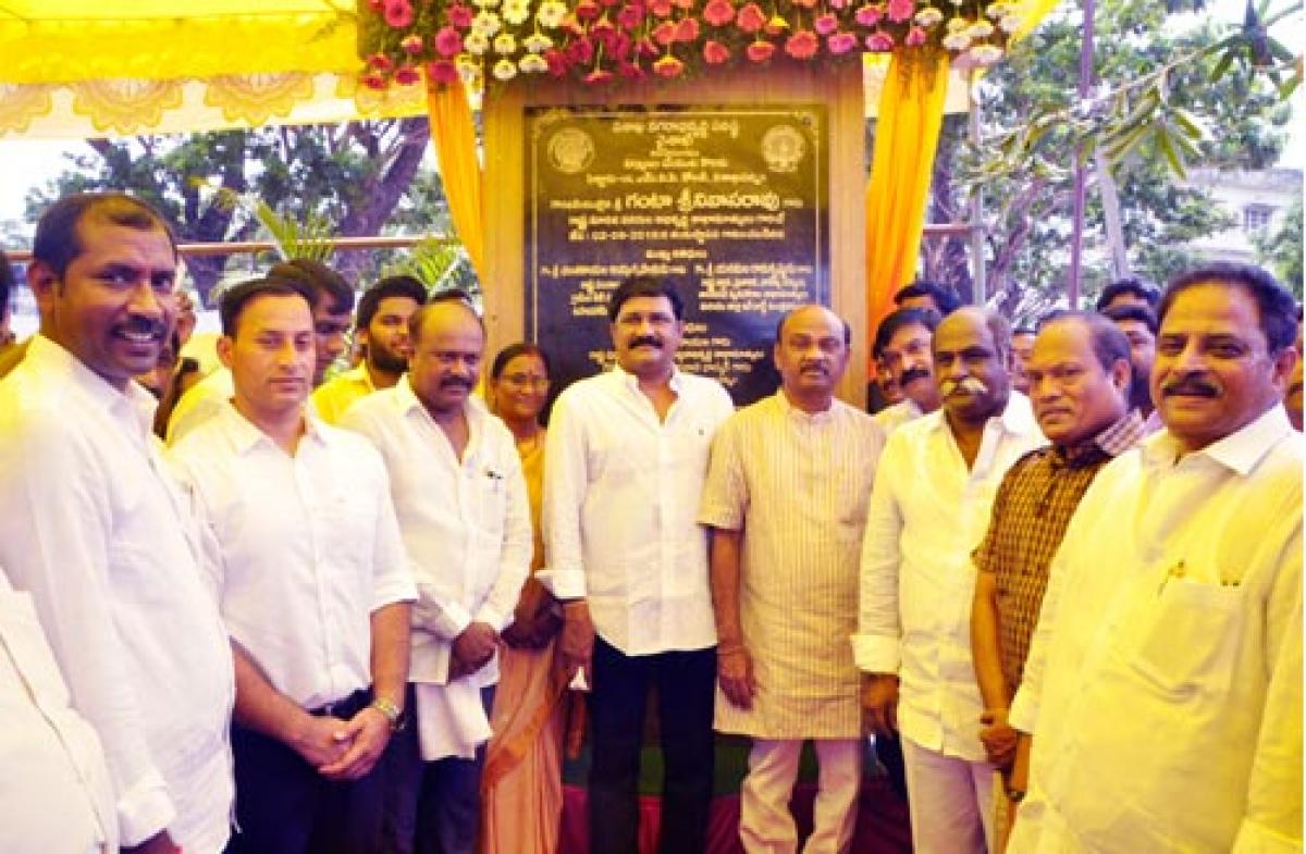 Ministers lay stone for auditorium