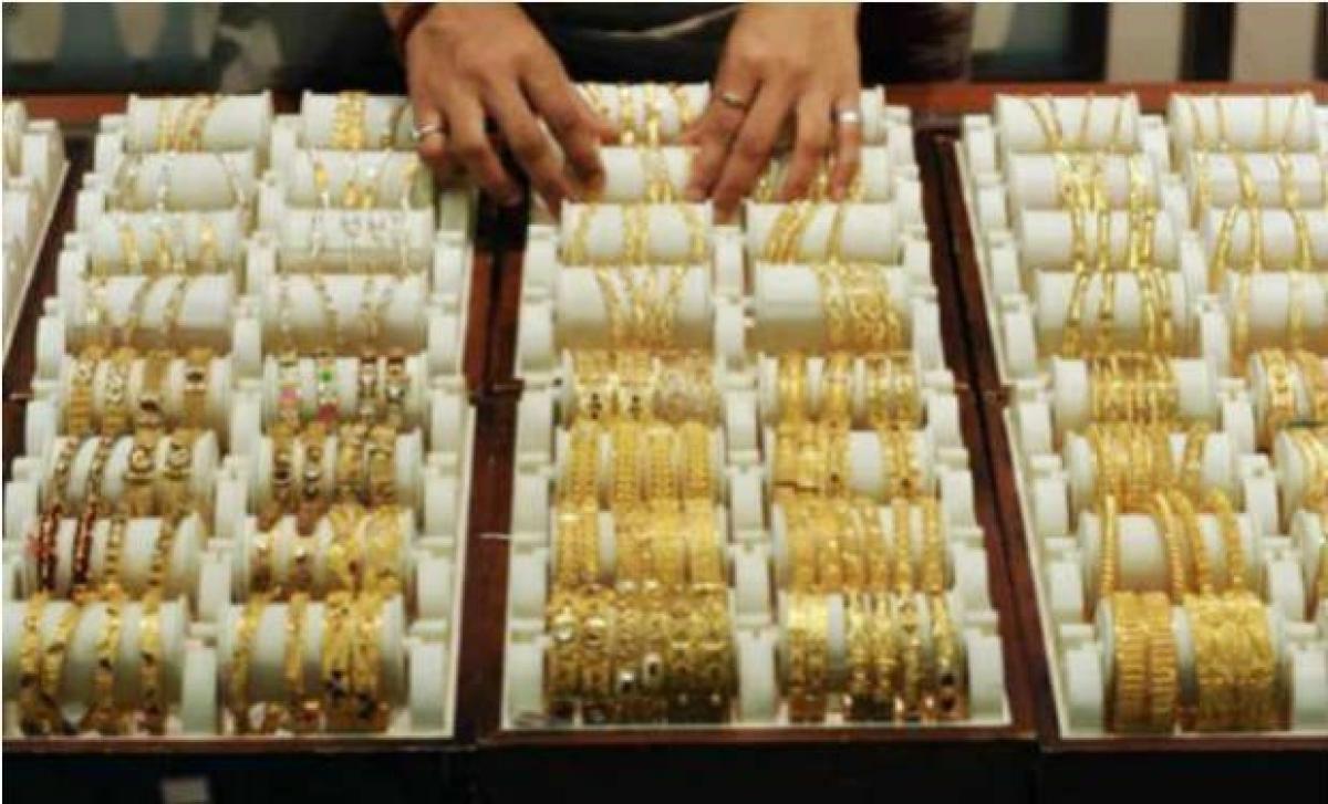 Gold weakens on global cues, sluggish demand
