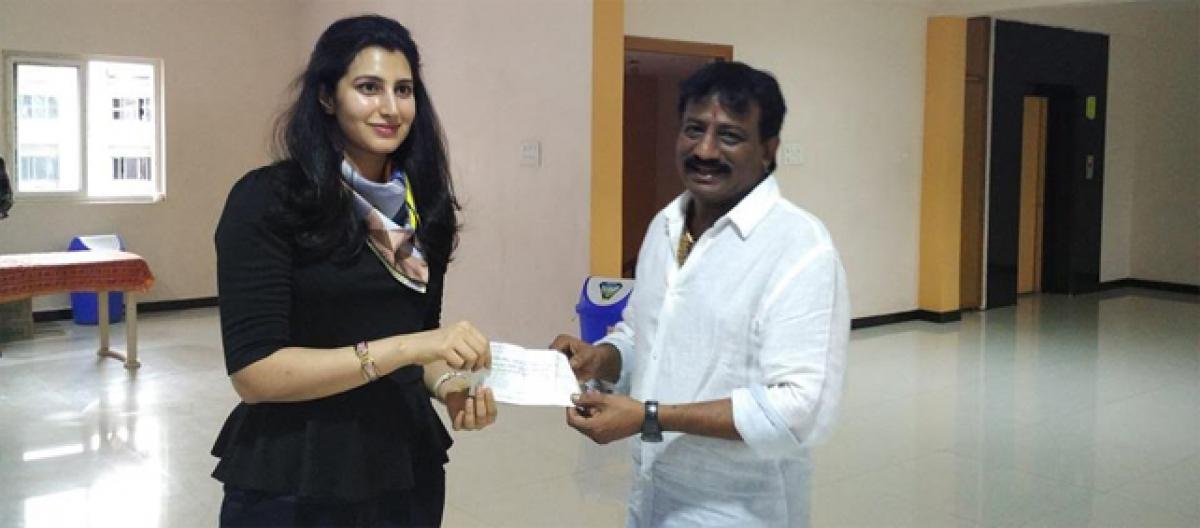 Sai Korrapati hands over Rs 25 lakhs to Babus daughter-in-law Bhrahmani