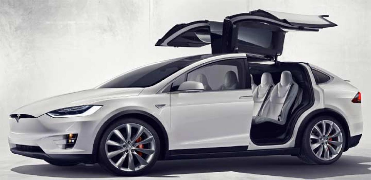 Tesla officially unveils Model X electric crossover