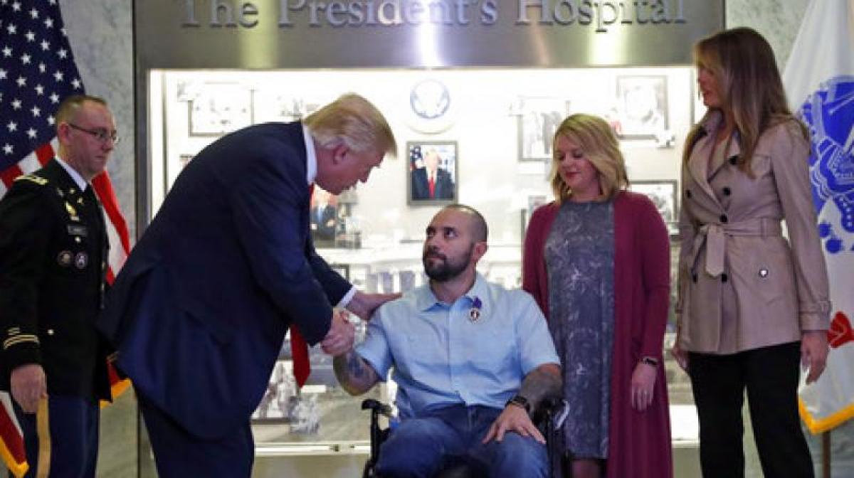 Trump awards Purple Heart at Walter Reed military hospital