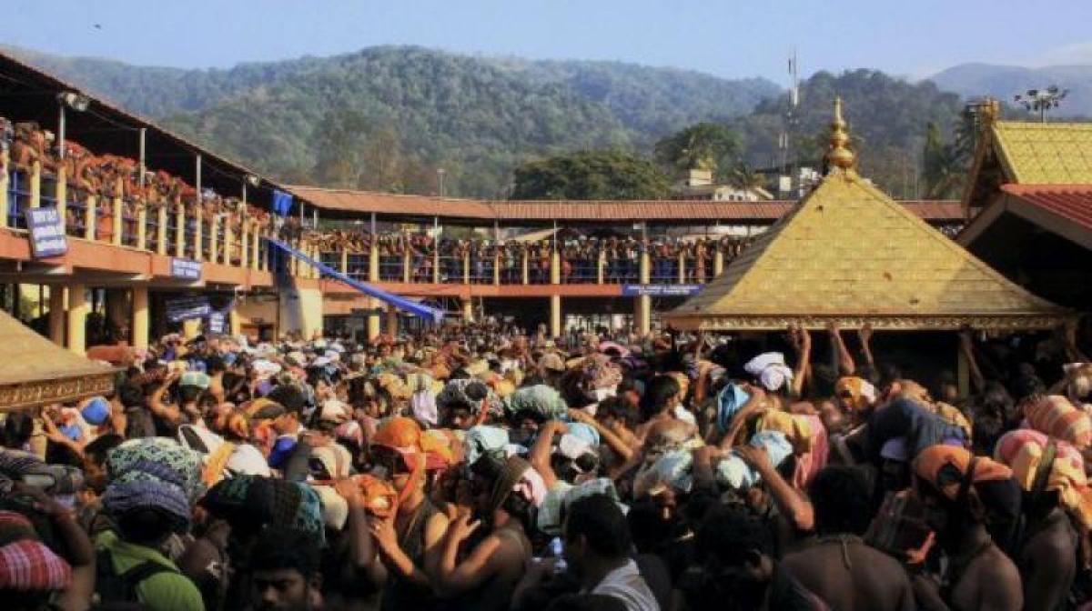 Photos of young women in Sabarimala surface, Kerala govt orders probe