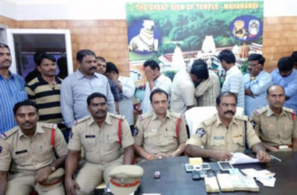 9 held for gambling; cash seized