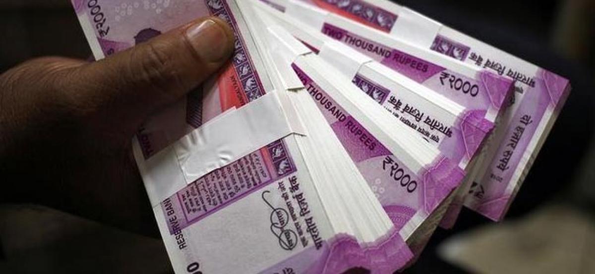 Rupee, bonds slide on Fed stance, but shares gain