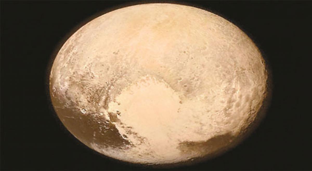 Pluto’s frozen surface may hide a vast liquid ocean