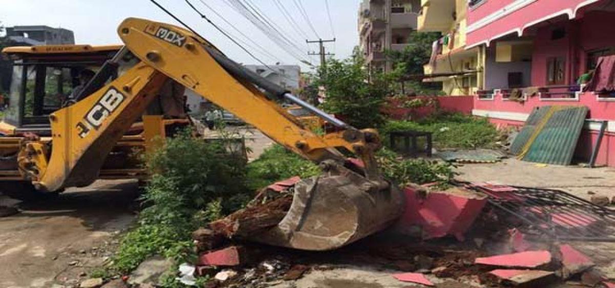 GHMC to penalise, then raze illegal structures