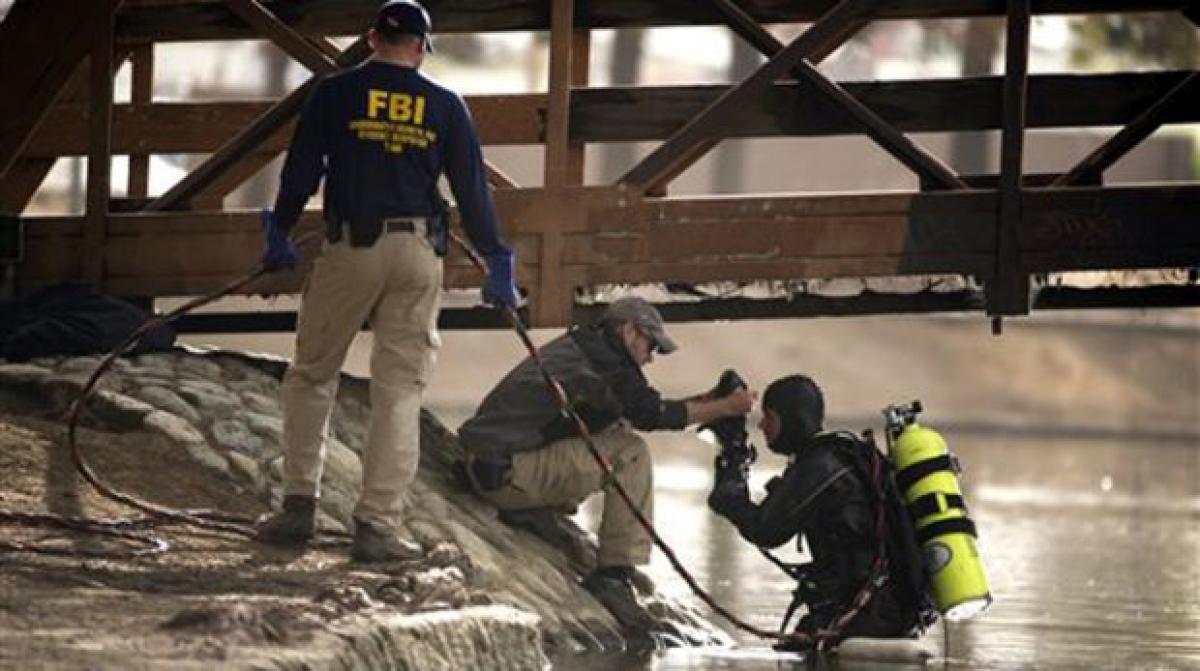 Divers retrieve more items in search for California shooting clues