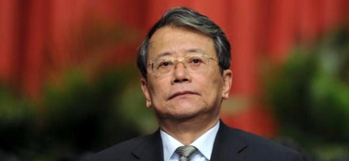 China charges brother of former aide to retired president over graft