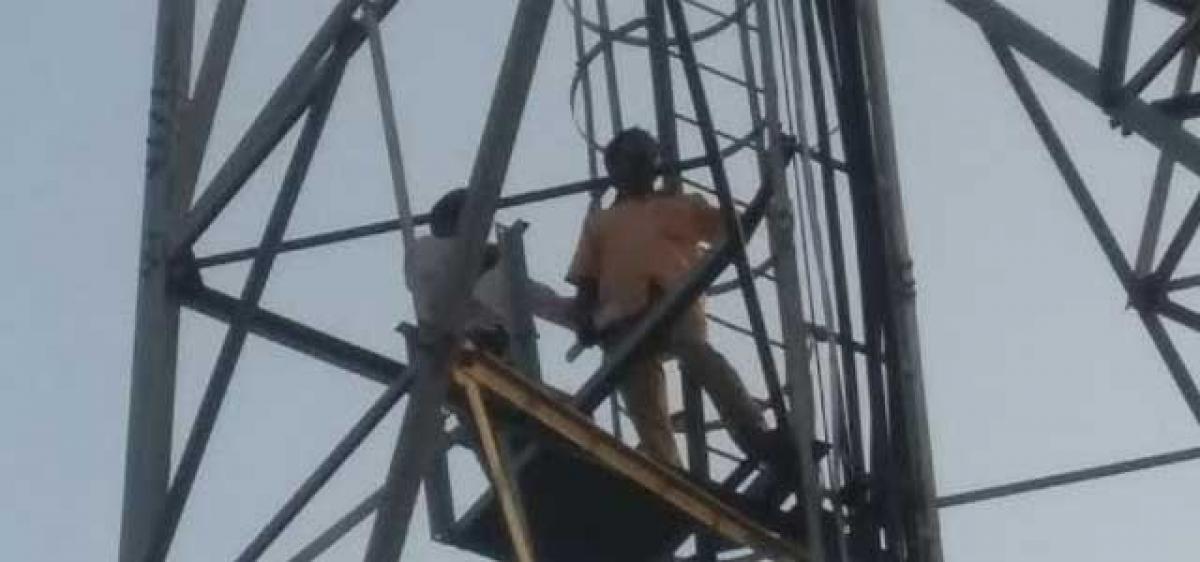 Ostracised by villagers, duo climbs cell tower for justice