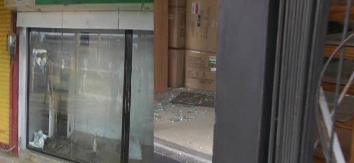 Student held for damaging glass doors of ATMs