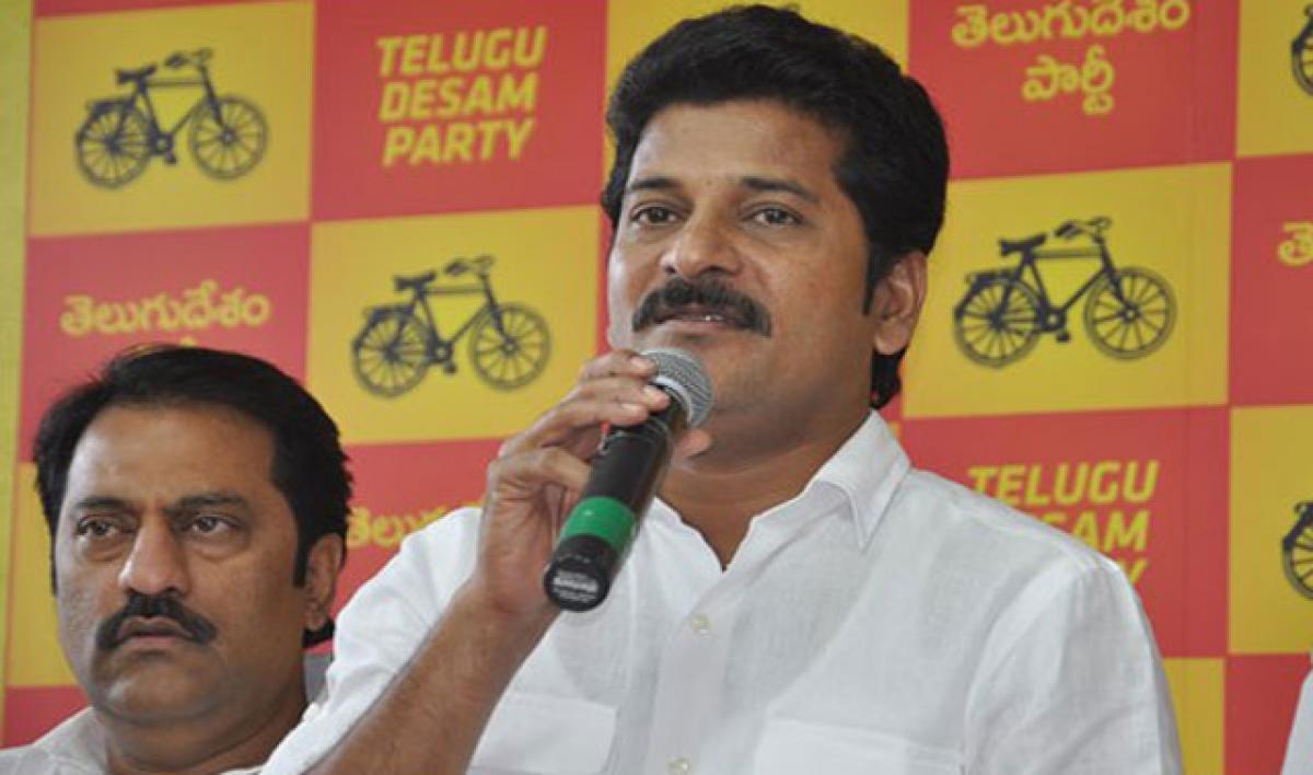 Revanth Reddy accuses KCR of luring TDP leaders into TRS