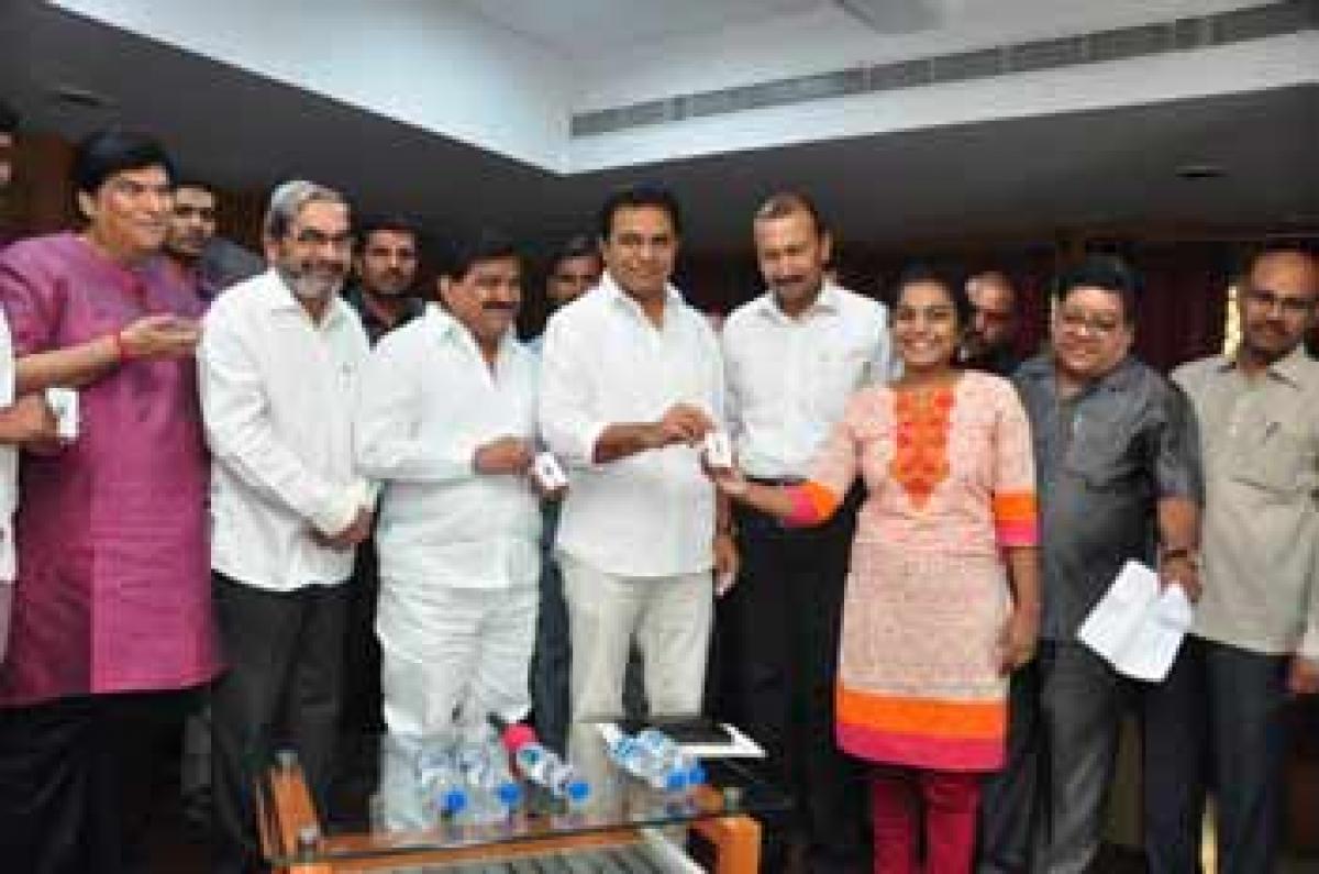 KTR distributes health cards to scribes