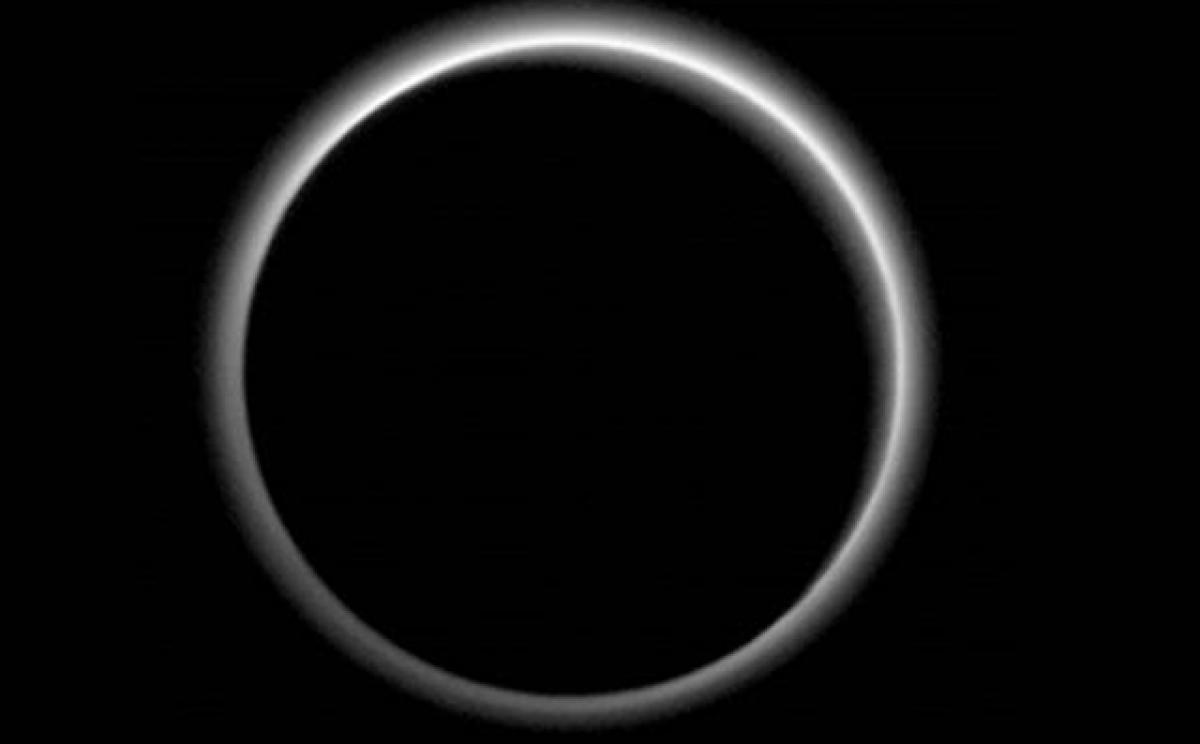 NASA Spacecraft Shows Pluto Wrapped in Haze, Ice Flows