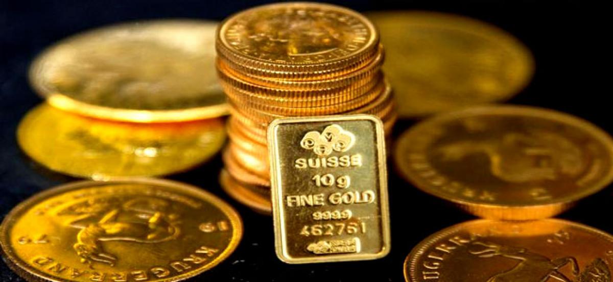 Gold slips as dollar climbs to 14-year high