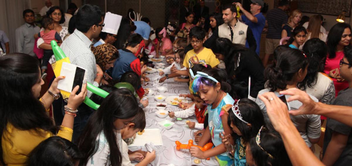 Kids’ carnival brings cheer at Cake Mixing Ceremony