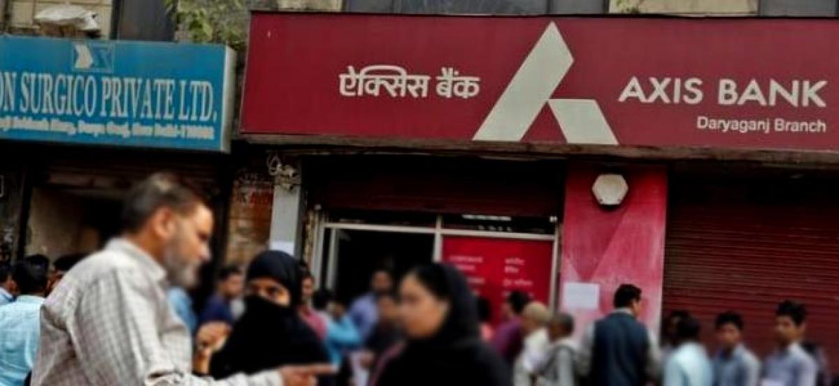 Sensex, Nifty end higher; Axis Bank up on takeover talk