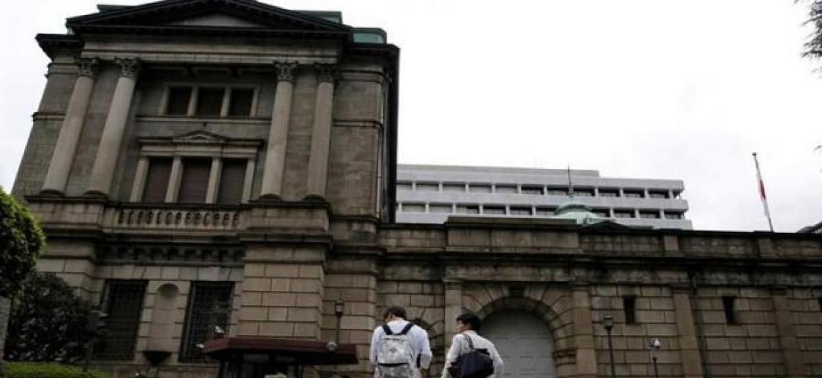 BOJ likely to cut inflation forecasts, wary of easing: sources