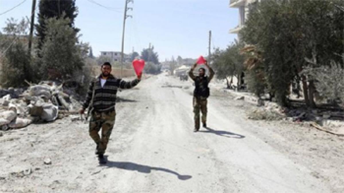 Syrians return to ravaged town retaken from ISIS