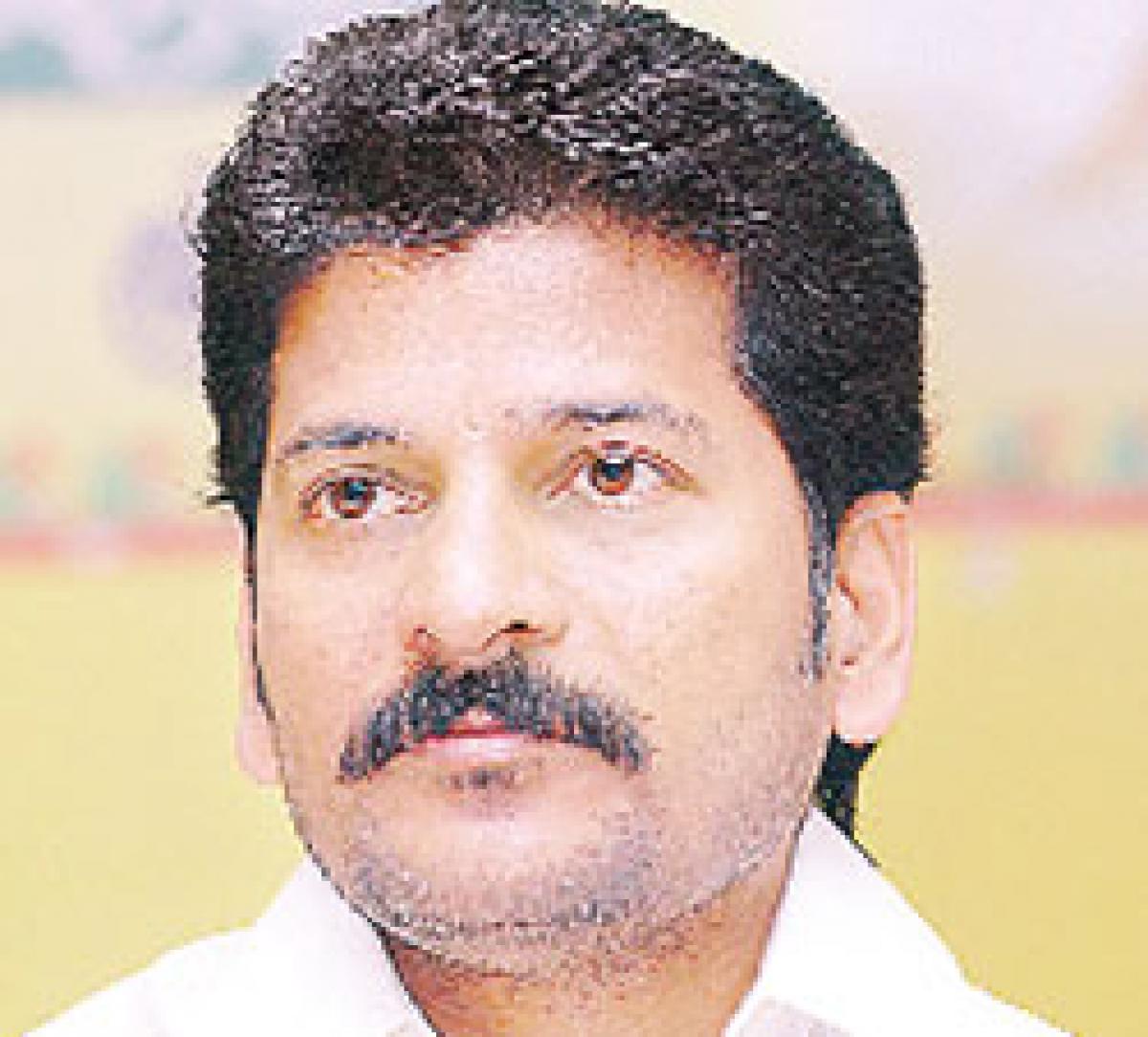 Conduct direct mayoral poll, demands Revanth