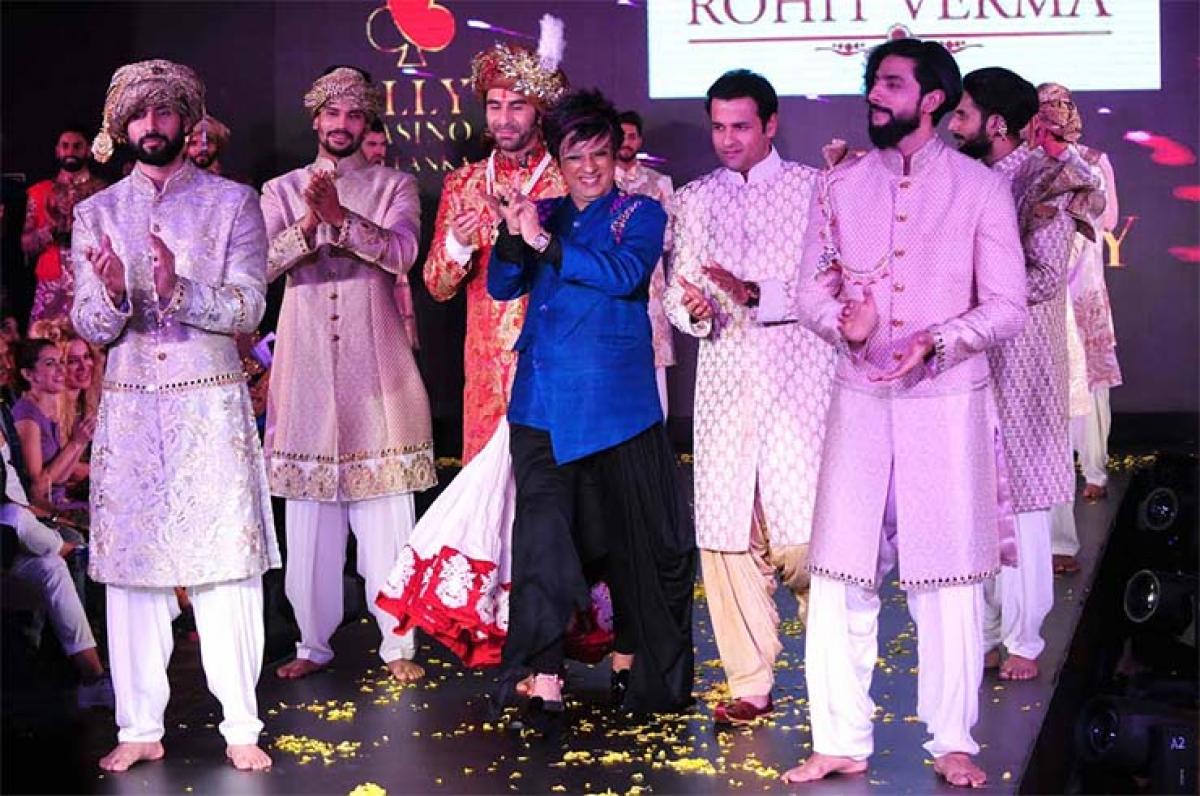 Sandip Soparrkar and Rohit Roy walk the ramp for designer Rohit Verma