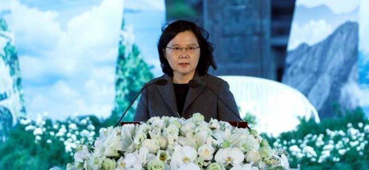 Taiwan urges reconciliation as China butts in on memorial