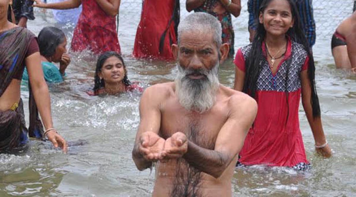 Muslim man takes holy dip.