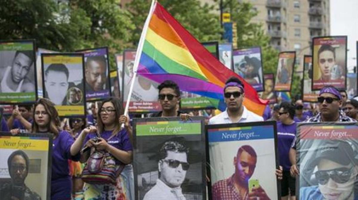 US parades celebrate Gay Pride, honor Orlando victims