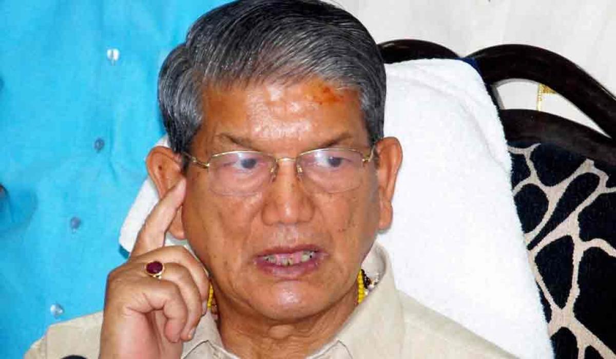 Ukhand showdown: Centre revokes Prez Rule, Rawat returns as CM