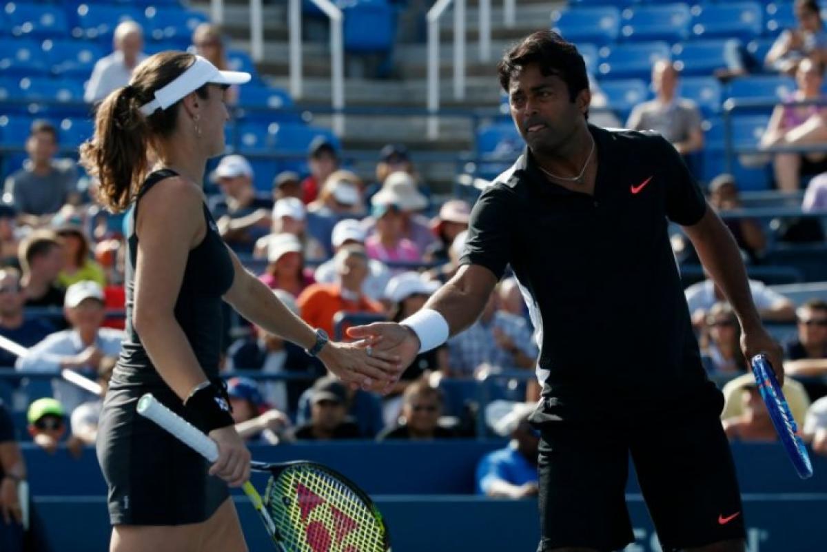 Australian Open: Paes wins first match in mixed doubles, Sania loses in womens doubles