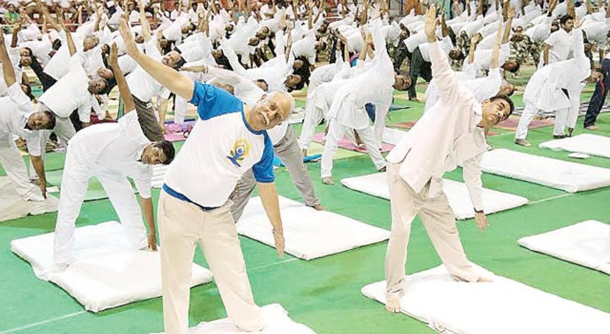 Strive for a peaceful world through Yoga: Ashok