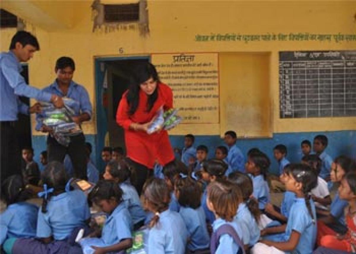NRI donates uniforms to govt school students.