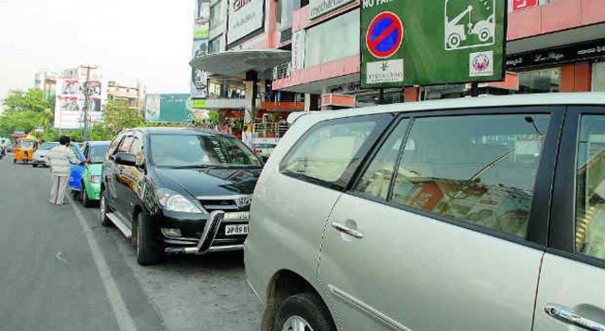 Civic body remains mute as footpaths turn into parking lots