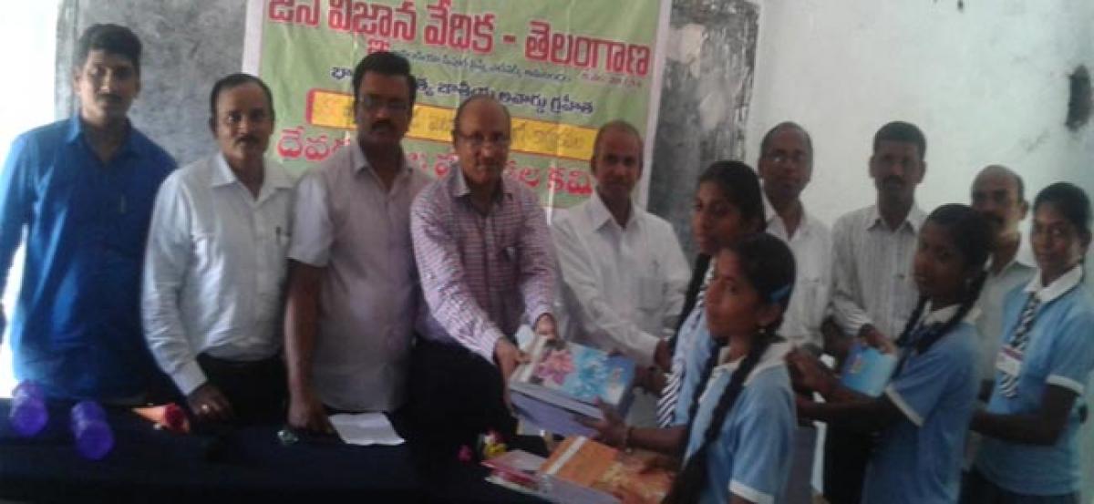 JVV Warangal committee distributes notebooks.