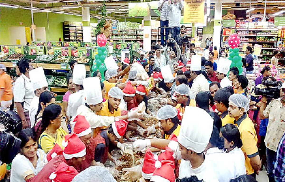 Special children take  part in cake mixing