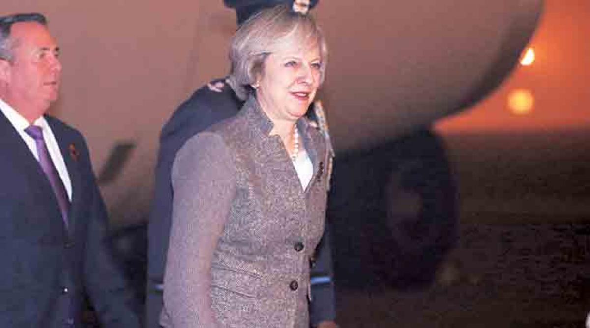 Theresa May arrives in India on three-day visit