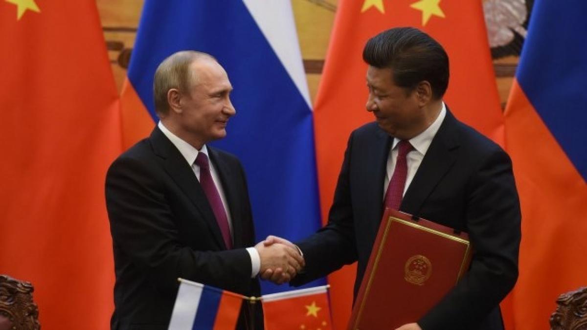 Russia secures energy deals, talks security with China as Vladimir Putin visits