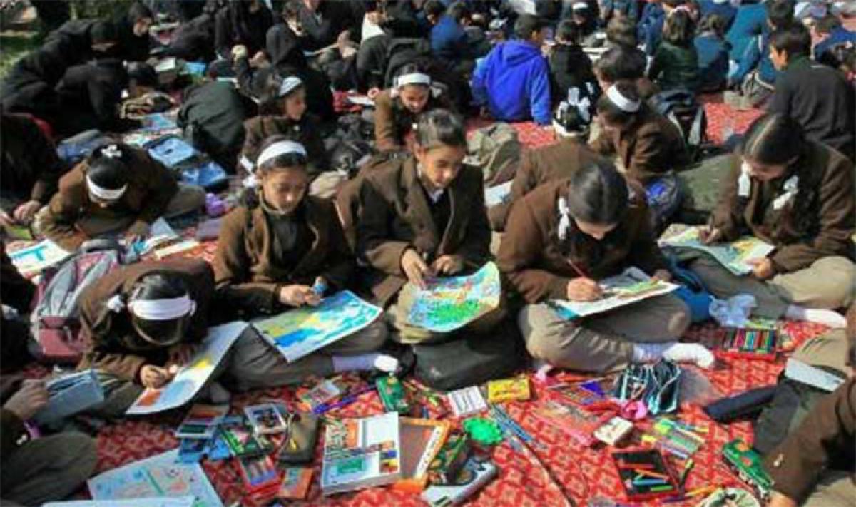 Kashmiri children paint their reality on the banks of Dal