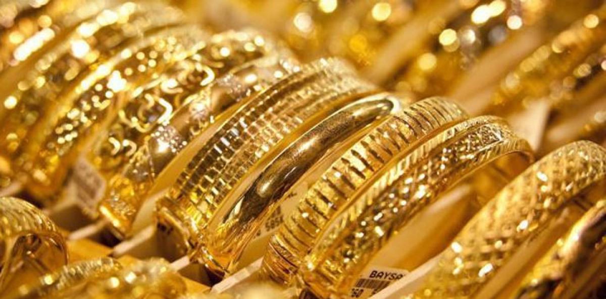Gold down on stronger US dollar ahead of Fed meeting