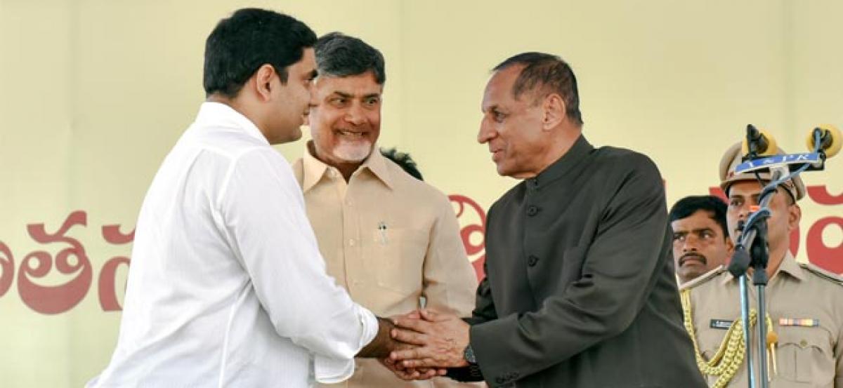 Naidu inducts son, 4 defectors