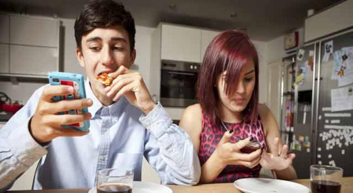 Relax! Texting or phone calls at dinner time is OK