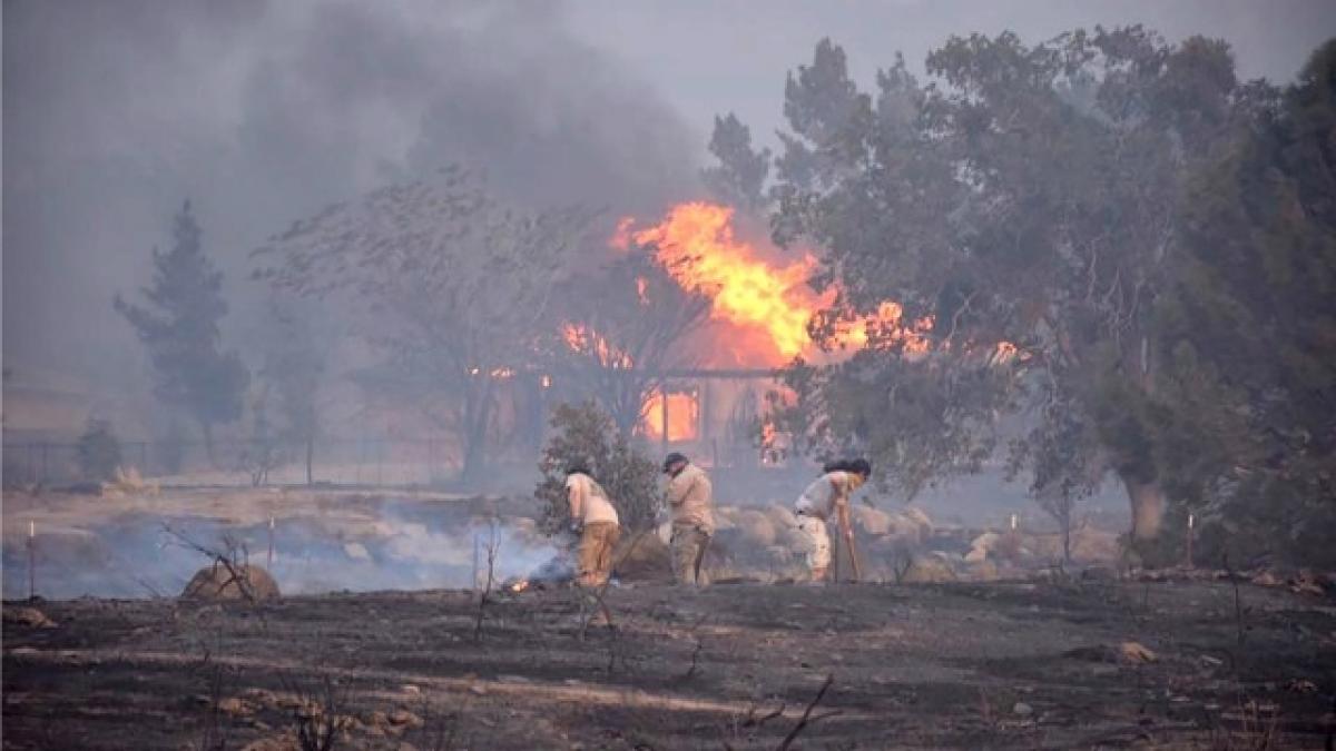 Two killed, 100 homes destroyed by fast-moving California wildfire