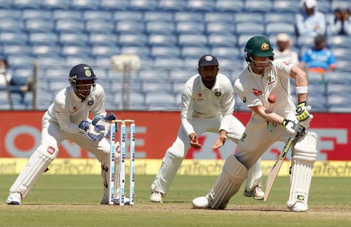 Australia 149/4 at tea, trail India by three runs