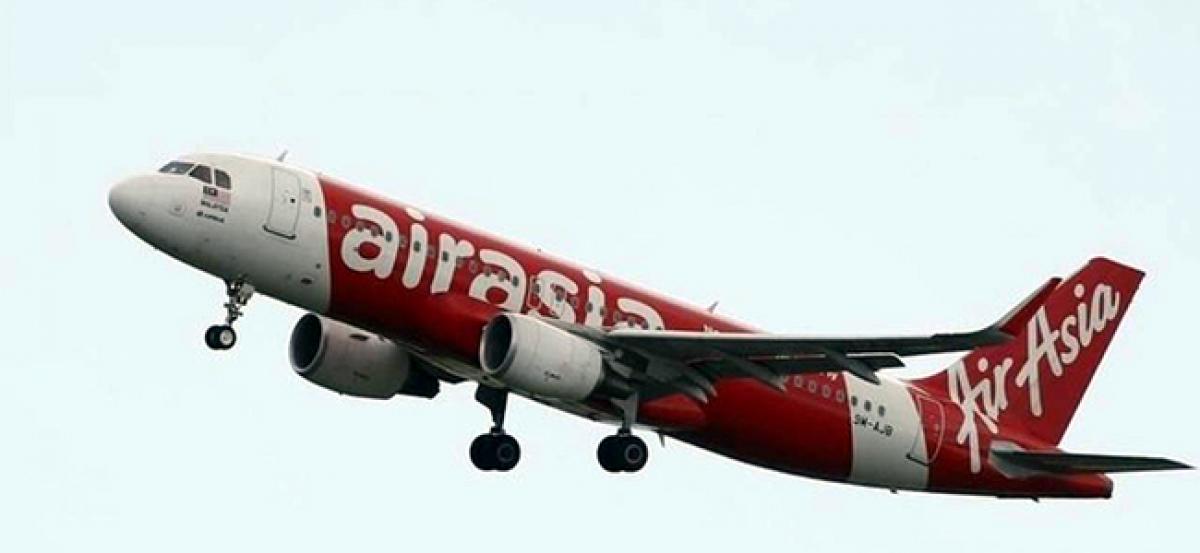 AirAsia shares at six-month low over raids at offices in India