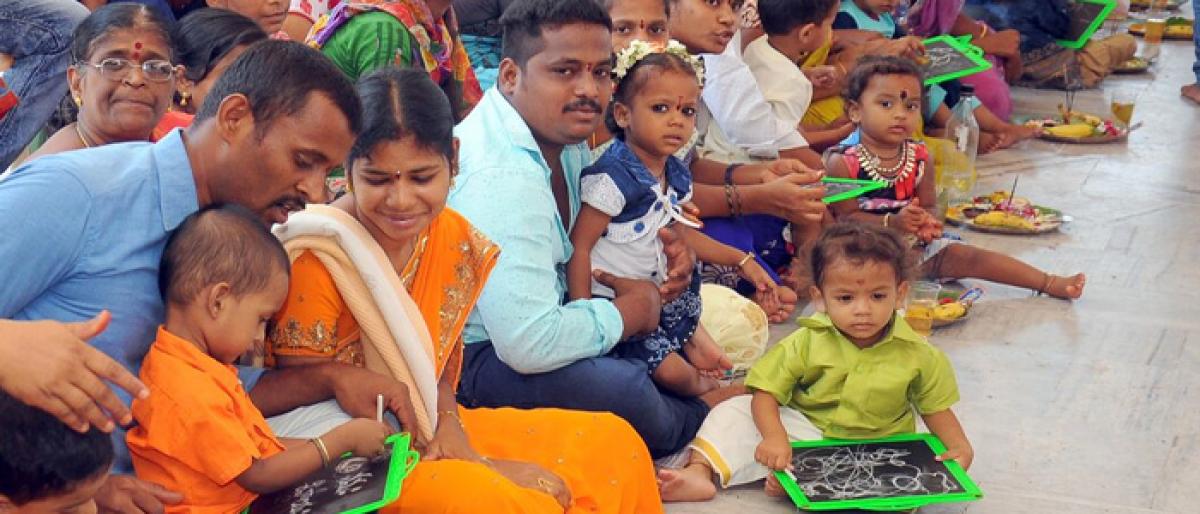 Mass Aksharabhyasam organised at Kali Matha temple in Vijayawada