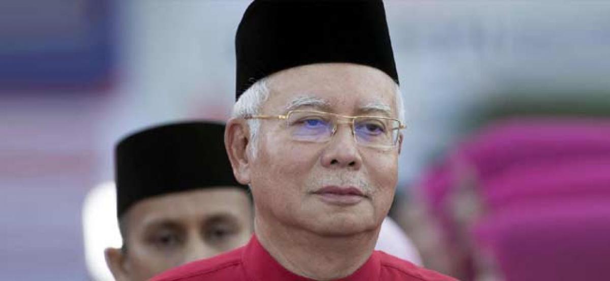 Malaysian police search five places linked to ousted PM Najib Razak