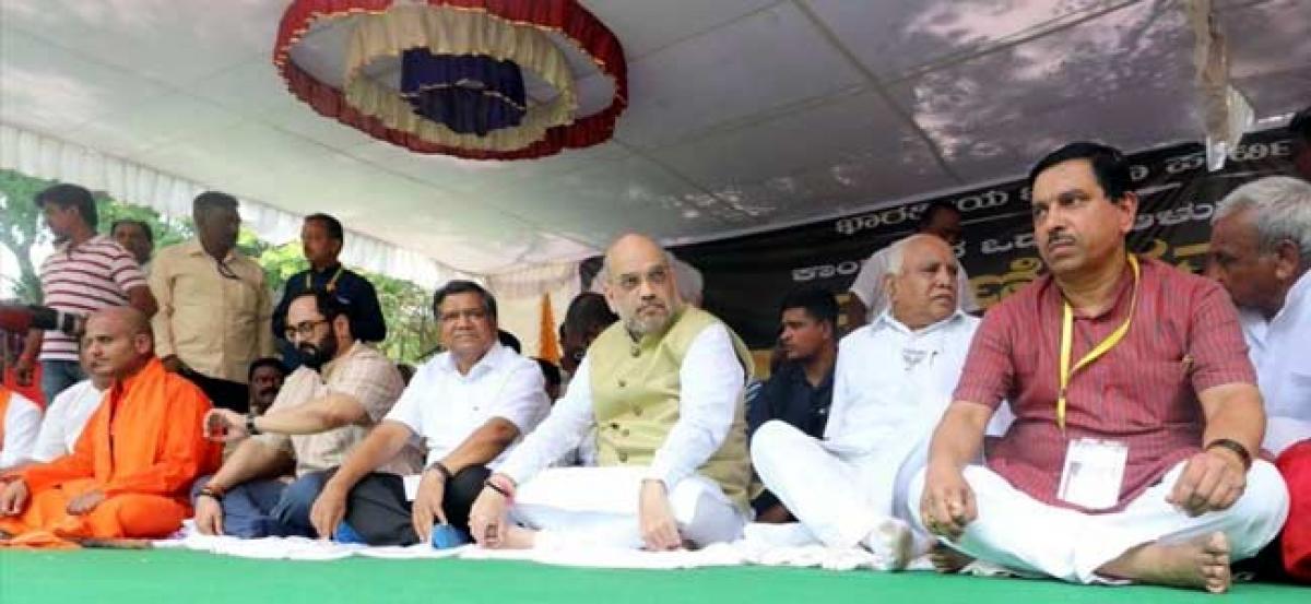 Karnataka: Amit Shah stages sit-in at Hubballi, lashes out at Congress