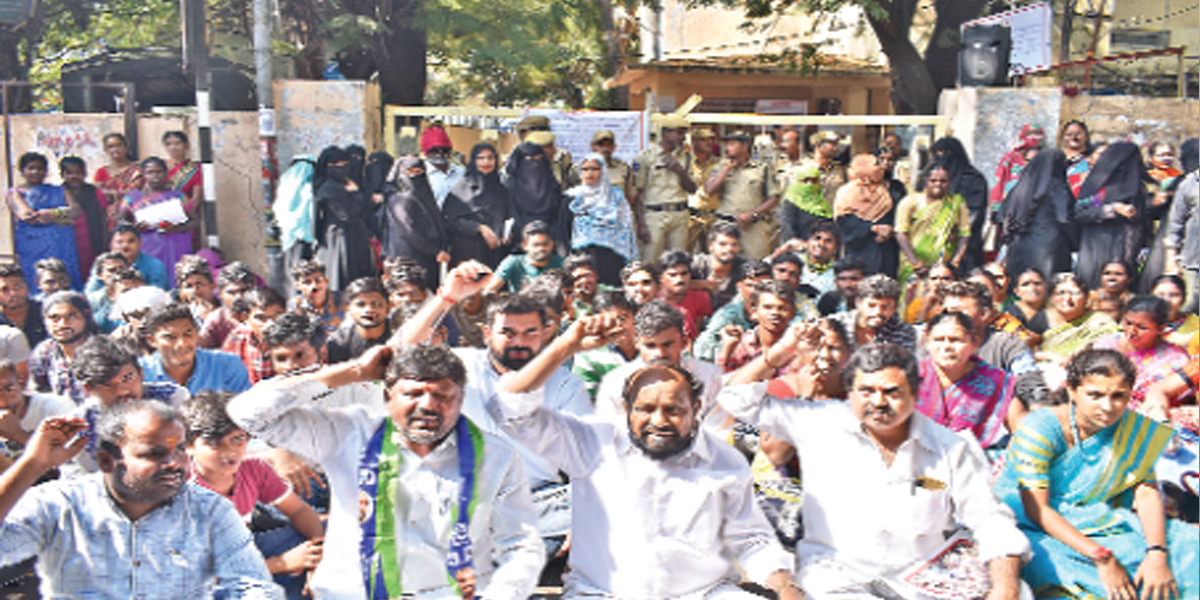 Riled by govt order, BCs stage dharna against quota cut