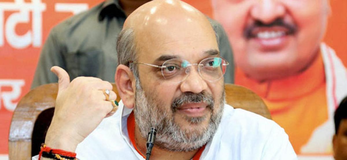 Shah tells Bengal BJP workers: Spread awareness about PMs schemes