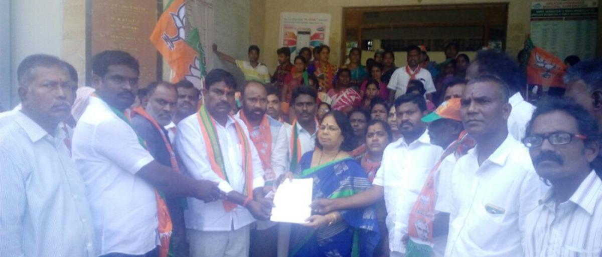 BJP asks GHMC not to demolish houses