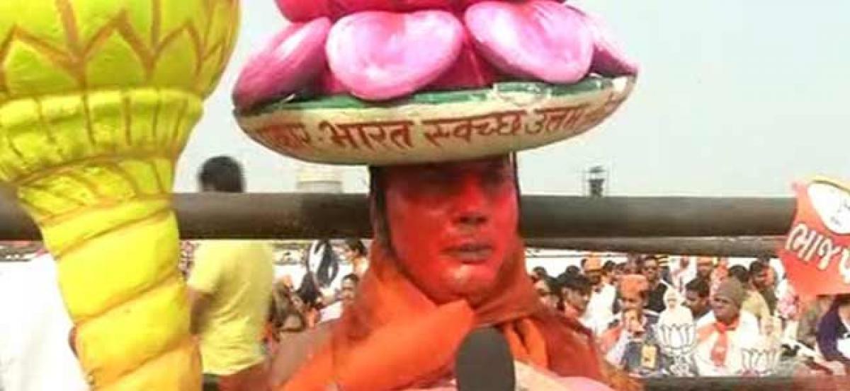 BJP supporter paints himself in saffron colour